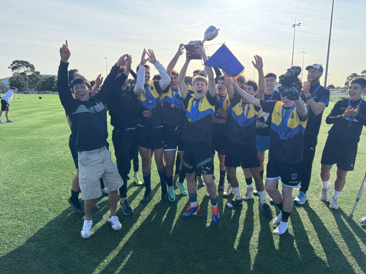 Senior Boys celebrating being crowned Soccer State Champions
