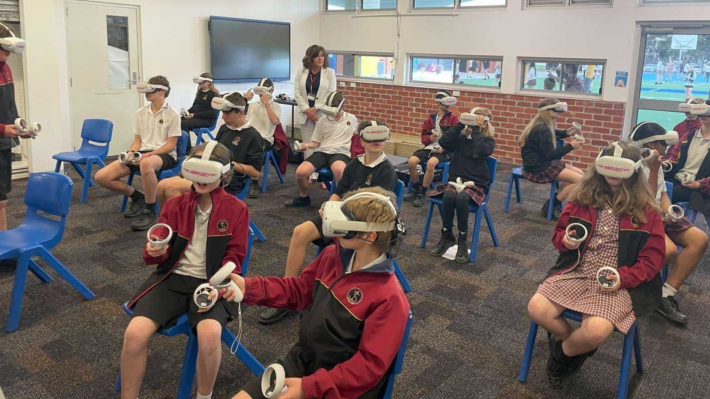 Ms Anna Skeljo from The Grange P-12 College learning about the VR experience from the students.