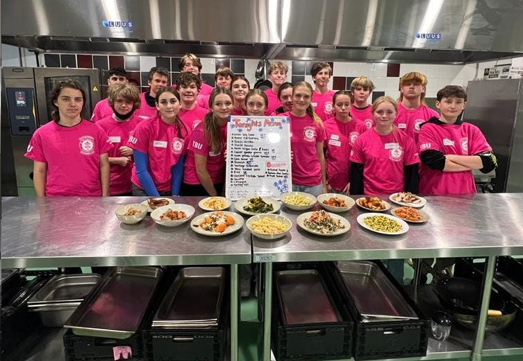 Immersion students with a sample of the meals they prepared, for The Big Umbrella